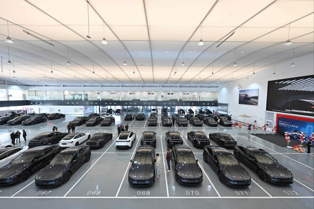 People checking out Model Y cars at Tesla’s Xiedao delivery centre in Beijing on February 27, 2025. Photo: AFP