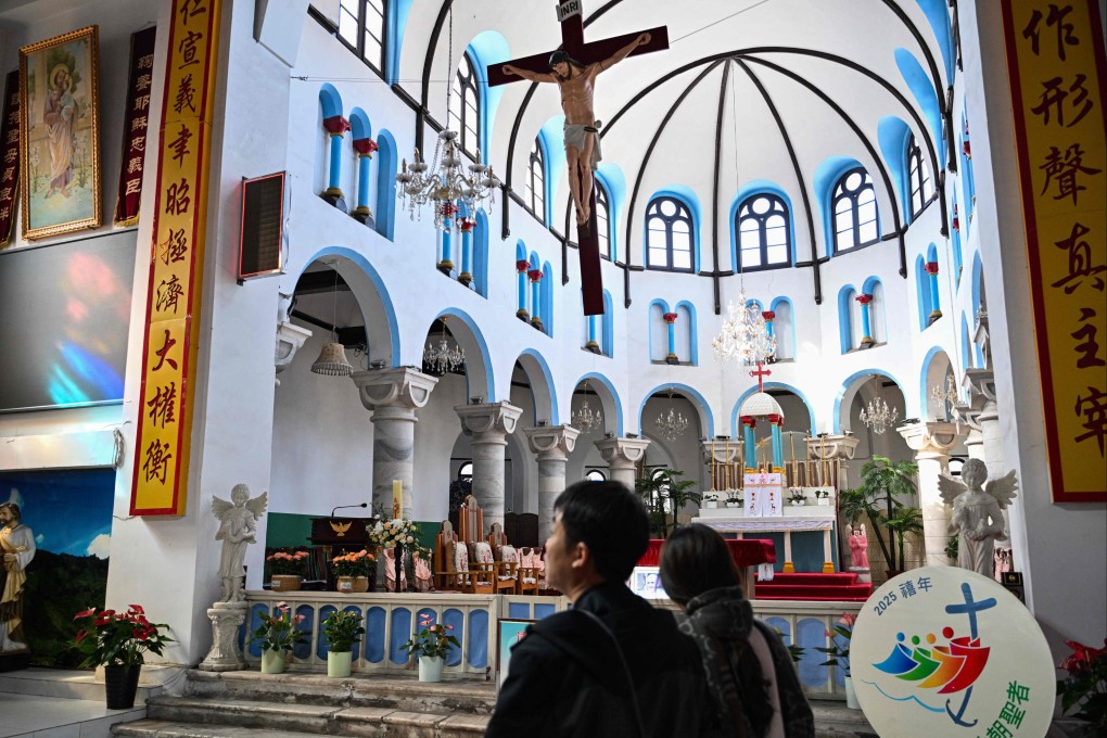 People visit a Catholic Church in Baoding, in China’s northern Hebei province on Tuesday,  a day after the death of Pope Francis. Photo: AFP