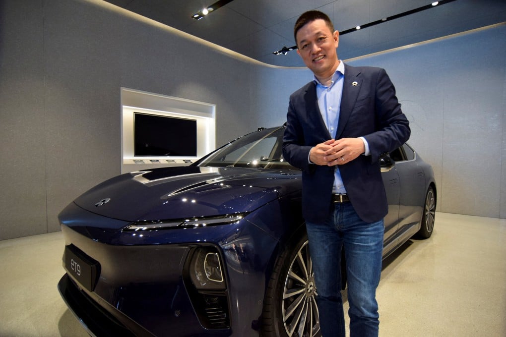 William Li, CEO of Chinese EV maker Nio, poses next to the company’s ET9, in Shanghai on April 22, 2025. Photo: Reuters