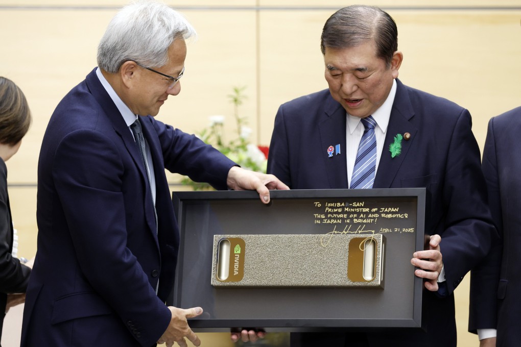 Japanese Prime Minister Shigeru Ishiba, right, receives a gift from Nvidia chief executive Jensen Huang at the start of their meeting in Tokyo on April 21, 2025. Photo: EPA-EFE