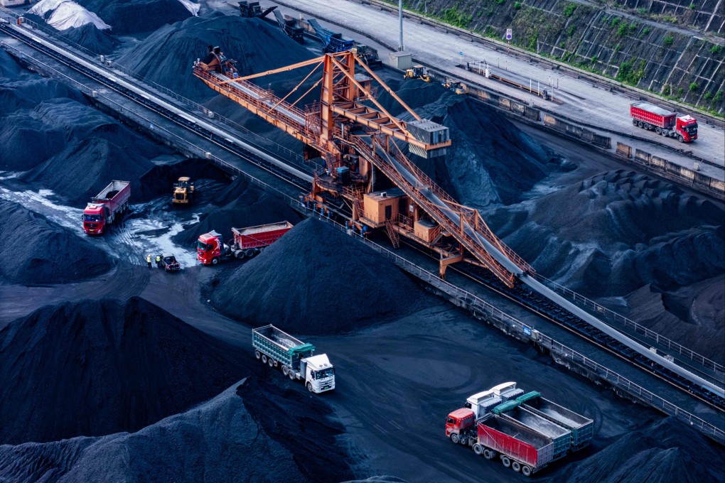 Vehicles transfer coal at a port in Chongqing, southwestern China on April 20. Photo: AFP