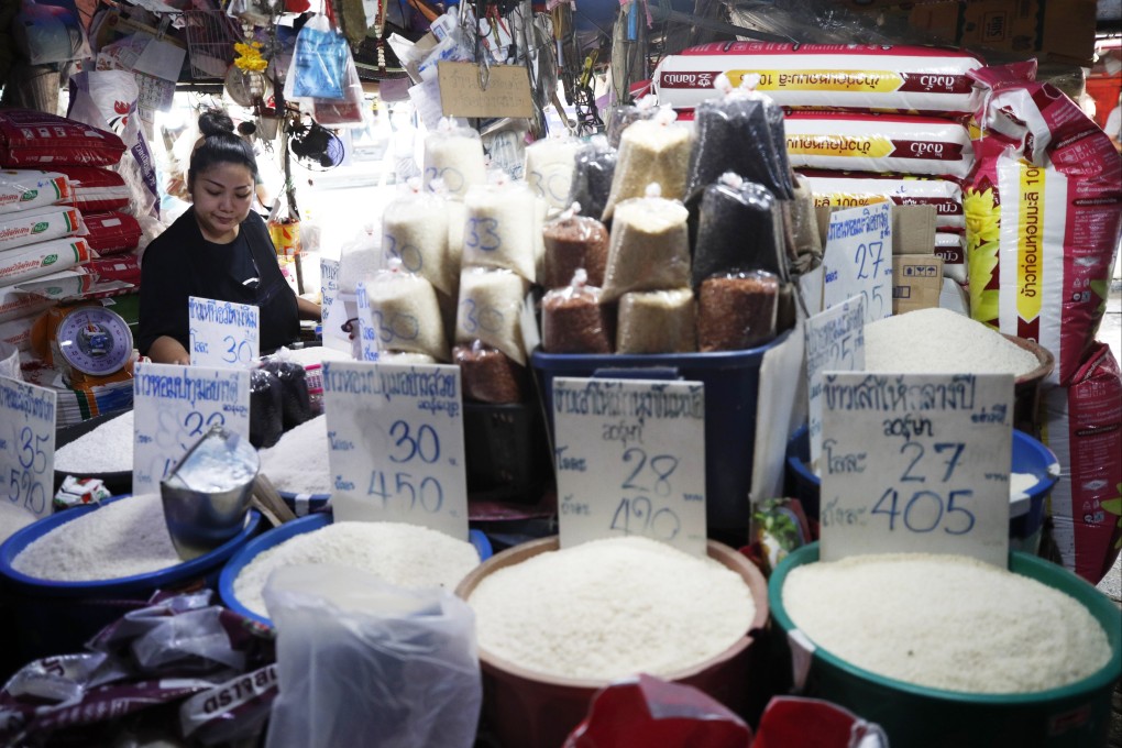 A rice vendor waits for customers at a market in Bangkok on April 7. Photo: EPA-EFE