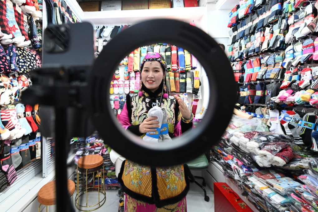 The owner of a sock shop in Yiwu International Trade City uses AI to generate a product introduction video in English on February 25 in Yiwu, Zhejiang province. Photo: China News Service via Getty Images