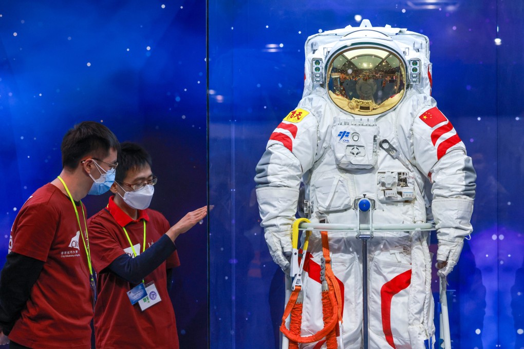 Attendees look at equipment used by Chinese astronauts at the InnoTech Expo in Hong Kong. Photo: May Tse
