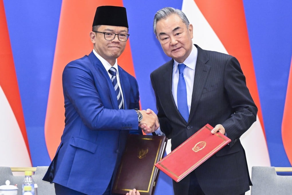 China’s Foreign Minister Wang Yi (right) and Indonesia’s Foreign Minister Sugiono shake hands after signing a memorandum of understanding after the first 2+2 meeting in Beijing on Monday. Photo: Xinhua/EPA-EFE