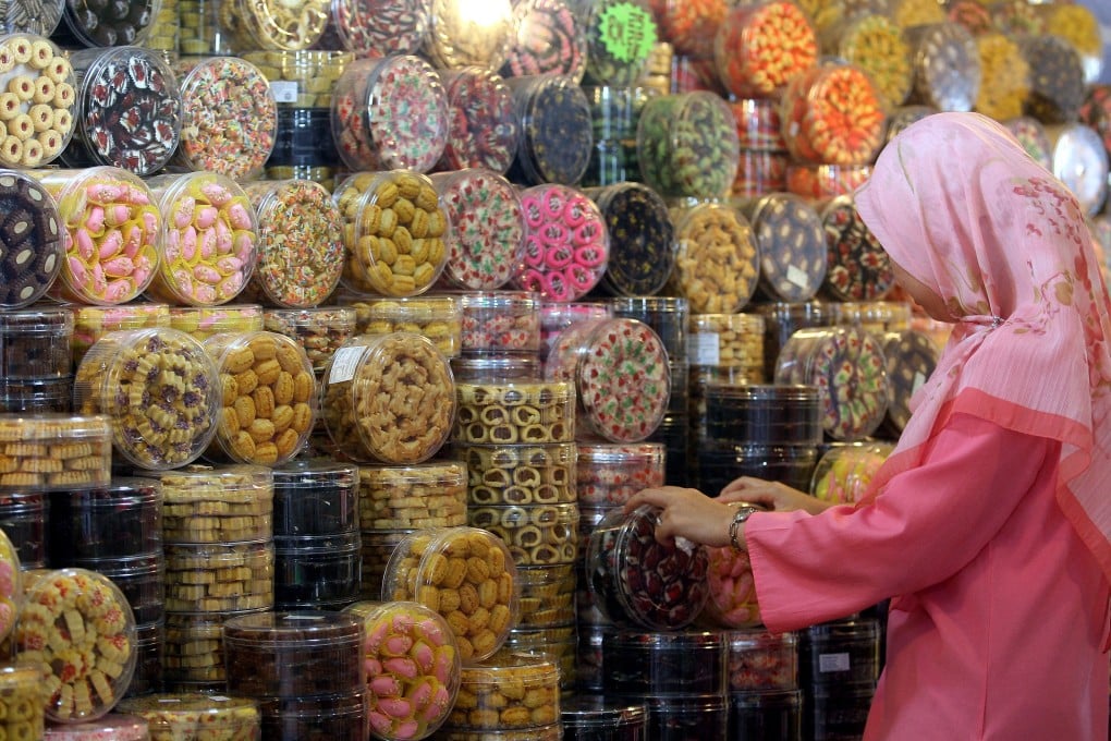 A woman browses biscuits and sweets in Kuala Lumpur. Photo: AFP