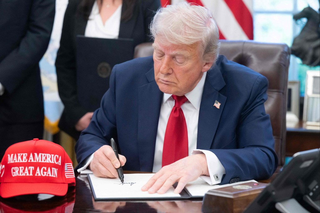 US President Donald Trump signs executive orders in the Oval Office of the White House on April 23. As Trump governs through unprecedented executive orders, the constitutional system of checks and balances shows signs of strain. Photo: AFP
