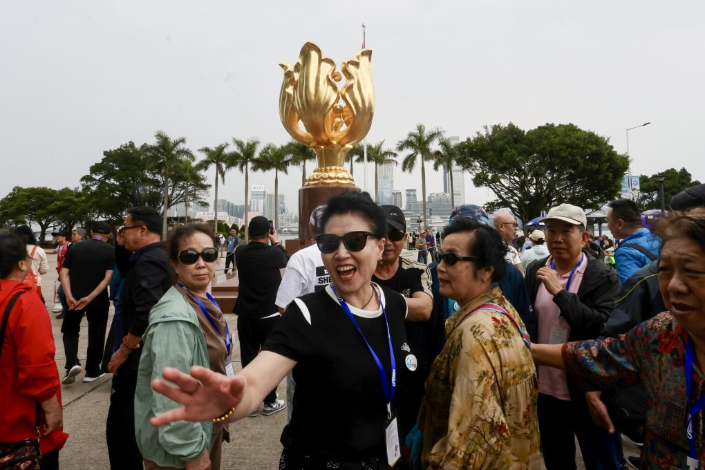 Mainland tourists visit Golden Bauhinia Square in Wan Chai. Photo: Jonathan Wong