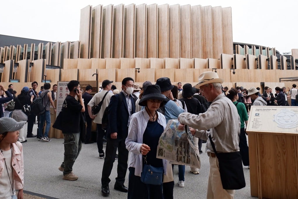 Visitors walk past the Japan Pavilion at the Osaka 2025 Expo on Tuesday. Photo: EPA-EFE