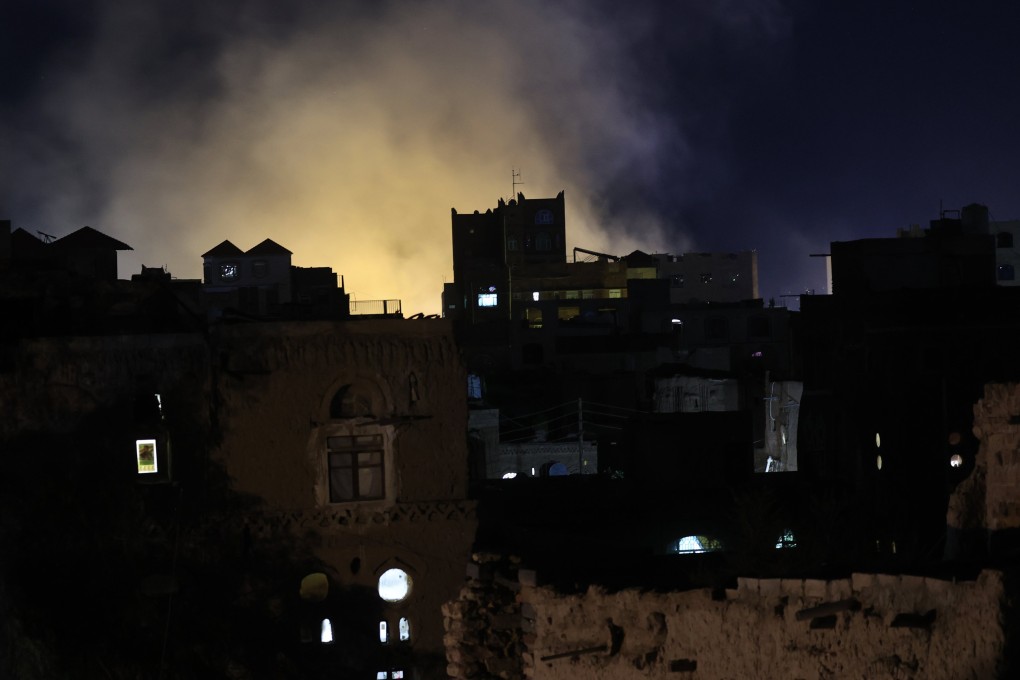 A plume of smoke billows above buildings following US air strikes on a neighbourhood in Sanaa, Yemen, on April 24. Photo: EPA-EFE