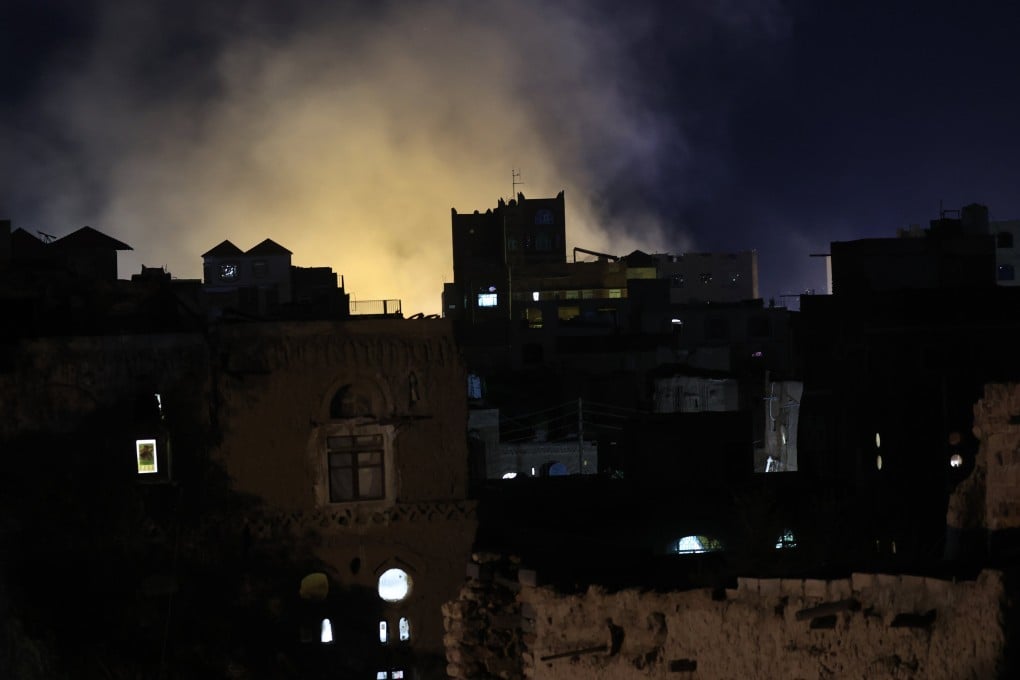 A plume of smoke billows above buildings following US air strikes on a neighbourhood in Sanaa, Yemen, on April 24. Photo: EPA-EFE