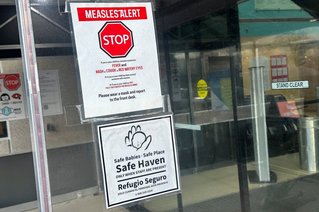 A measles alert sign hangs outside the entrance to the Cohen Children’s Medical Centre in New York in March. Photo: Reuters