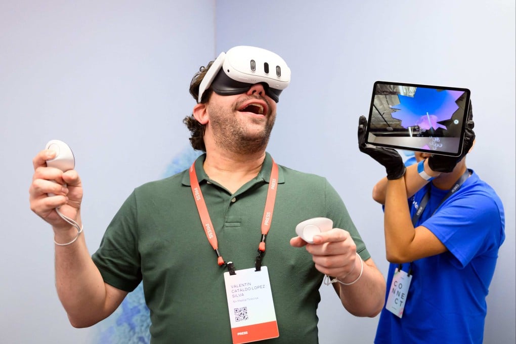 A person tries out a MetaQuest 3 headset at the Facebook parent’s headquarters in Menlo Park, California. Photo: AFP
