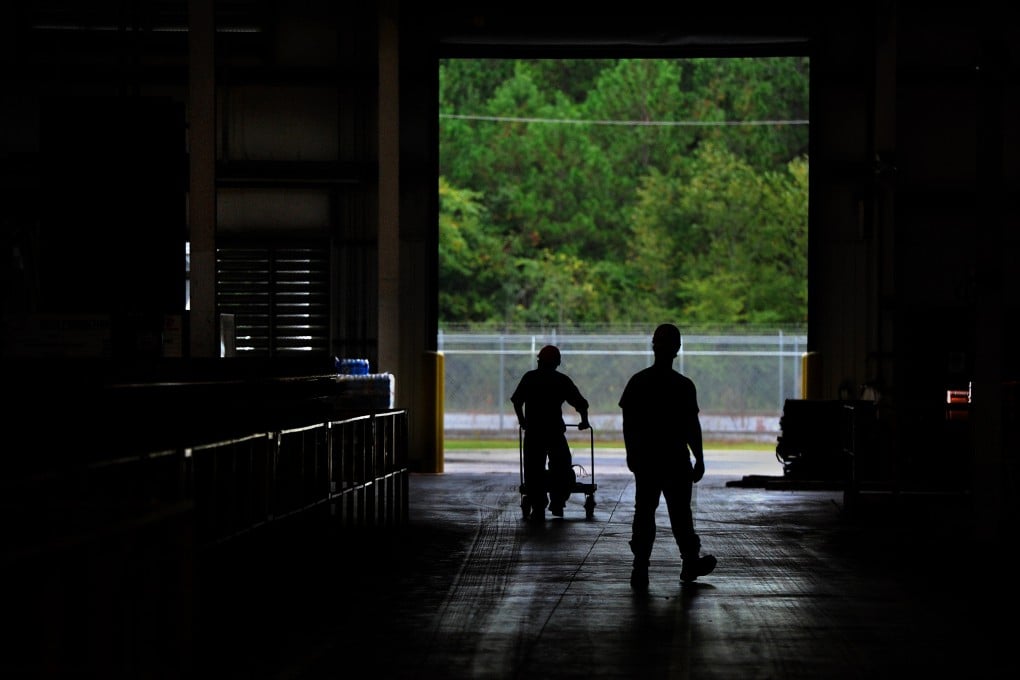 Workers walk across a Chinese-owned copper pipe factory in rural Alabama. Chinese companies in a slew of industries are rushing to set up American facilities to avoid sky-high tariffs on Chinese goods. Photo: Getty Images
