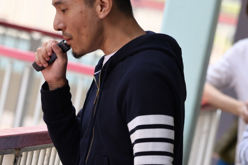 A man smokes an e-cigarette in Admiralty. Photo: Dickson Lee