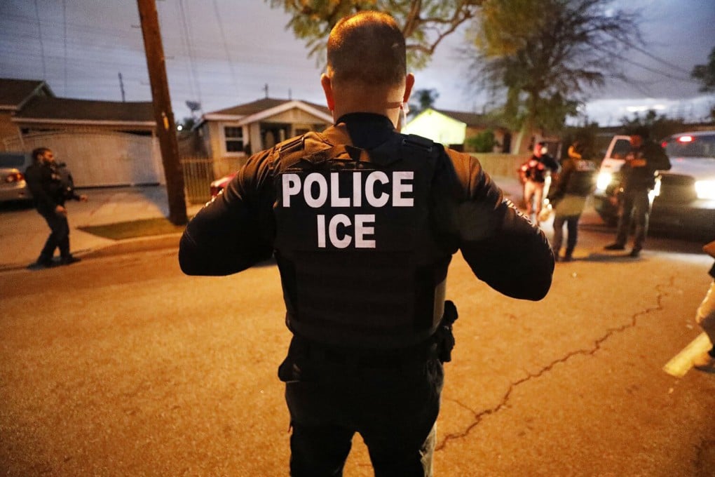 A US Immigration and Customs Enforcement (ICE) agent takes part in a pre-dawn raid. Photo: Los Angeles Times/TNS