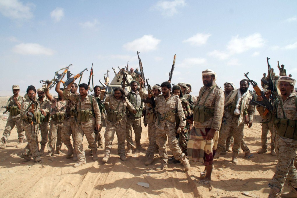 Yemeni soldiers brandish their weapons as they take part in an offensive in the southern province of Shabwa in 2014. Photo: AFP
