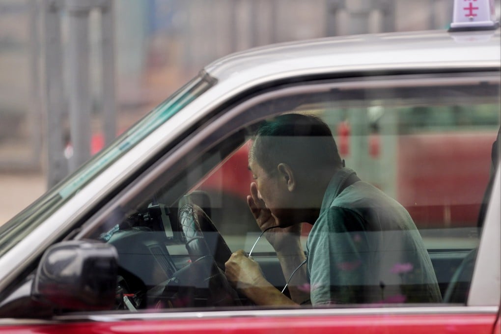 An elderly cabbie waits for customers at a taxi stand in Mong Kok. In the first two months of this year, 95 elderly taxi drivers were involved in traffic accidents. Photo: Elson Li