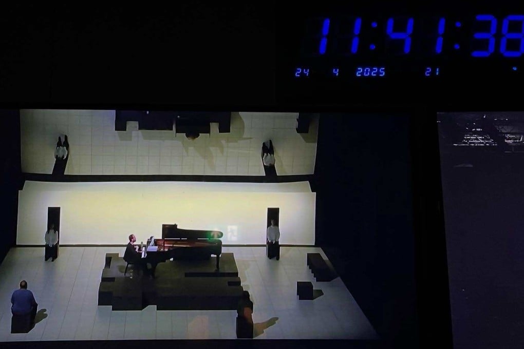 A clock above the stage at London’s Queen Elizabeth Hall shows pianist Igor Levit in the 12th hour of his marathon performance of Erik Satie’s Vexations directed by Marina Abramovic. Photo: Instagram/cathycatlondon