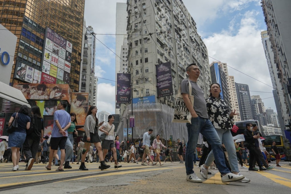 Pedestrians cross a road in Causeway Bay, one of Hong Kong’s prime shopping districts, on April 20, 2025. Photo: Sun Yeung