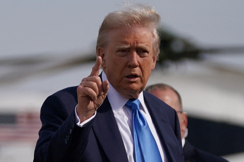 US President Donald Trump gestures as he walks to board Air Force One at Joint Base Andrews in Maryland on Friday. Photo: Reuters