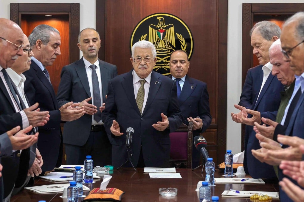 Palestinian President Mahmoud Abbas (centre) leading prayers next to Hussein al-Sheikh (third from left) in Ramallah on Saturday. Photo: Palestinian Authority Press Office via AFP