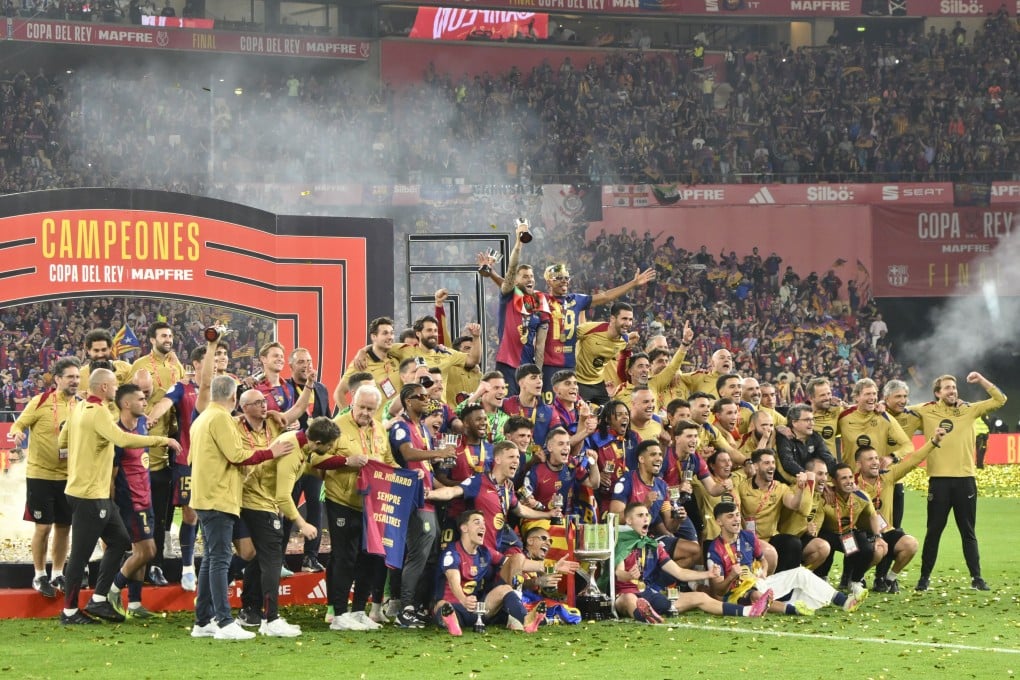 Barcelona players celebrate victory over Real Madrid in the Copa del Rey final in Seville. Photo: EPA