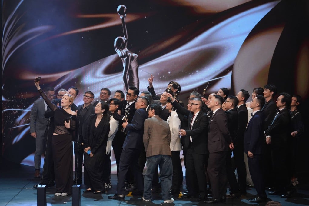 Cast and crew members of Twilight of the Warriors: Walled In celebrate the best film win. Photo: Eugene Lee