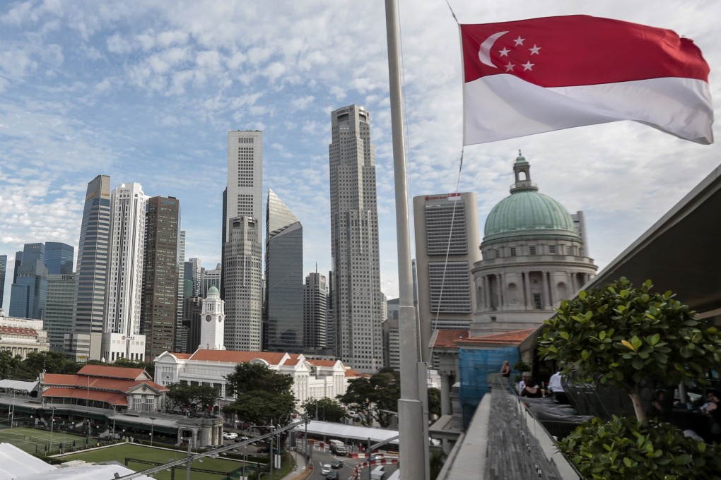 The Singapore flag flies against the skyline of the city state’s financial district. Singapore faces a 10 per cent levy from the US despite a bilateral free trade agreement. Photo: EPA-EFE