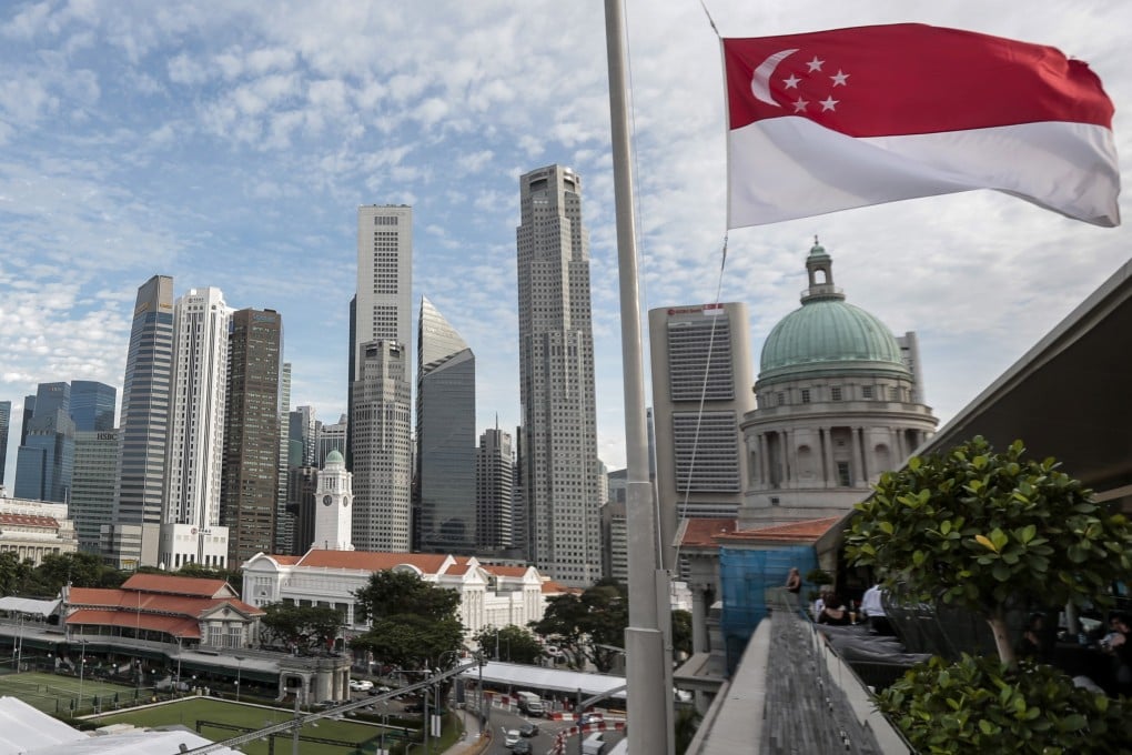 The Singapore flag flies against the skyline of the city state’s financial district. Singapore faces a 10 per cent levy from the US despite a bilateral free trade agreement. Photo: EPA-EFE