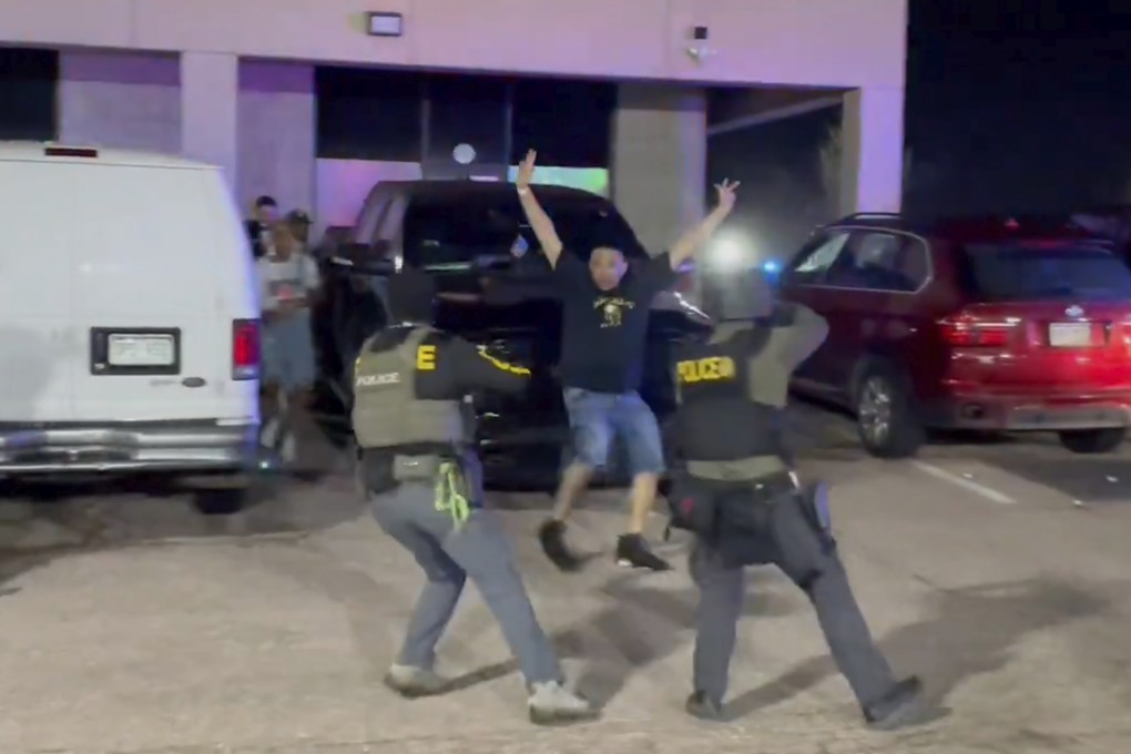 US Drug Enforcement Administration officers stop a patron outside a nightclub where a raid took place on Sunday in Colorado Springs, Colorado. Photo: Drug Enforcement Administration via AP