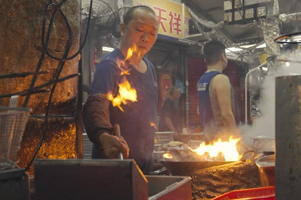 Cooks working in a dai pai dong in Hong Kong. From such street food stalls to fine-dining Cantonese restaurants, customers savour the effect of wok hei, the “breath of the wok”, in their food. Photo: Llewellyn Cheung