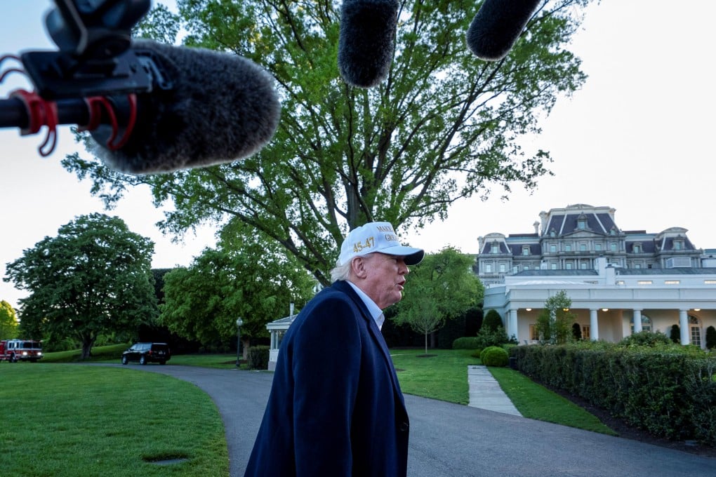 US President Donald Trump takes questions from reporters outside the White House on Sunday. Photo: Reuters