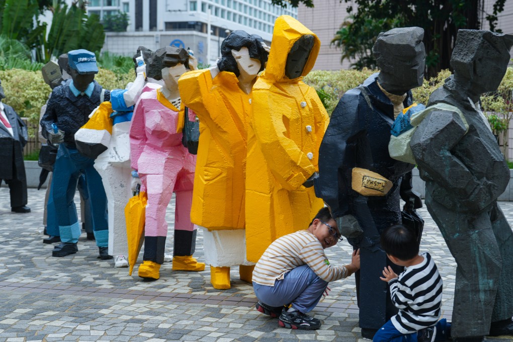 Lining Up, a row of 10 cast bronze sculptures of everyday people by the late Taiwanese artist Ju Ming, had stood outside the Cultural Centre in Tsim Sha Tsui for years. Photo: Sam Tsang