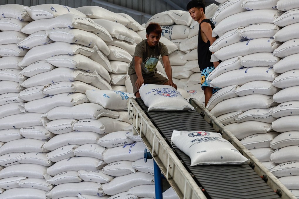 Workers move sacks of rice for transport from a National Food Authority warehouse in Metro Manila, Philippines. Photo: EPA-EFE