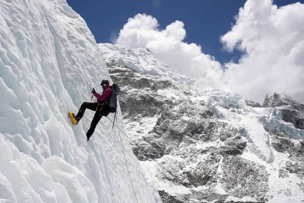 A mountaineer holds on to a rope during an ice climbing session at Everest Base Camp in Nepal earlier this month. Photo: Reuters