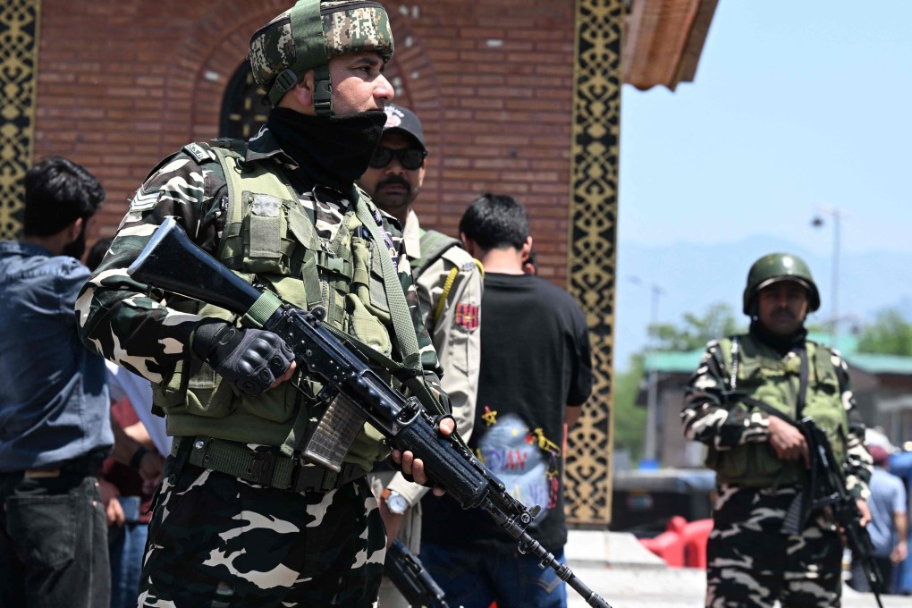 Indian paramilitary troopers stand guard at a market area in Srinagar, Indian-administered Kashmir, on Monday. Photo: AFP