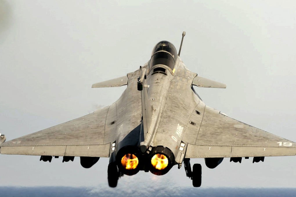 A Rafale jet fighter takes off from the flight deck of an aircraft carrier. Photo: AP