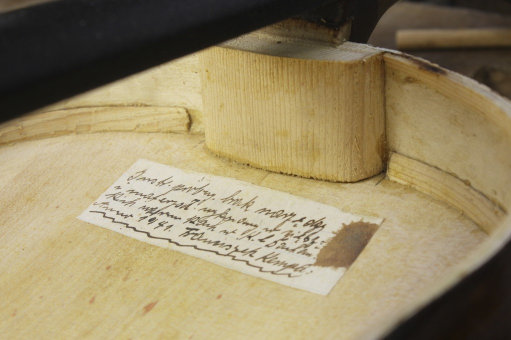 A hidden handwritten message in the Silesian dialect - a mix of Polish and German - is seen inside an instrument dubbed the ‘’violin of hope’’ made by Franciszek “Franz” Kempa at the Dachau concentration camp near Munich, Germany, in 1941. Photo: AP