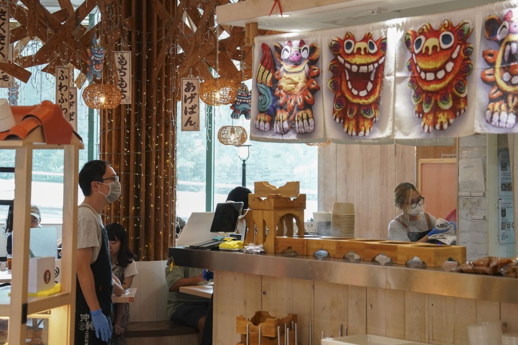 Waiters work in a restaurant at Diamond Hill. The waiting industry in particular appears to have been troubled by layoffs, and the subsequent hiring of staff from outside Hong Kong.  Photo: Elson Li