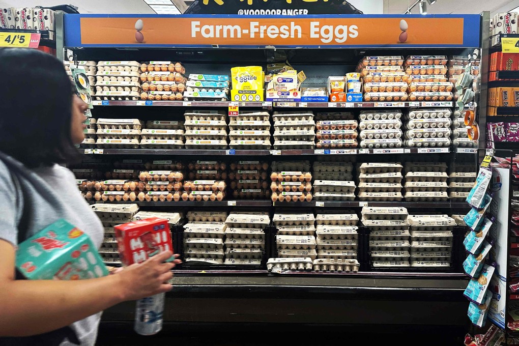A supermarket shopper walks past a display of eggs in Monterey Park, California. US consumer confidence in April saw its largest monthly decline since the pandemic. Photo: AFP