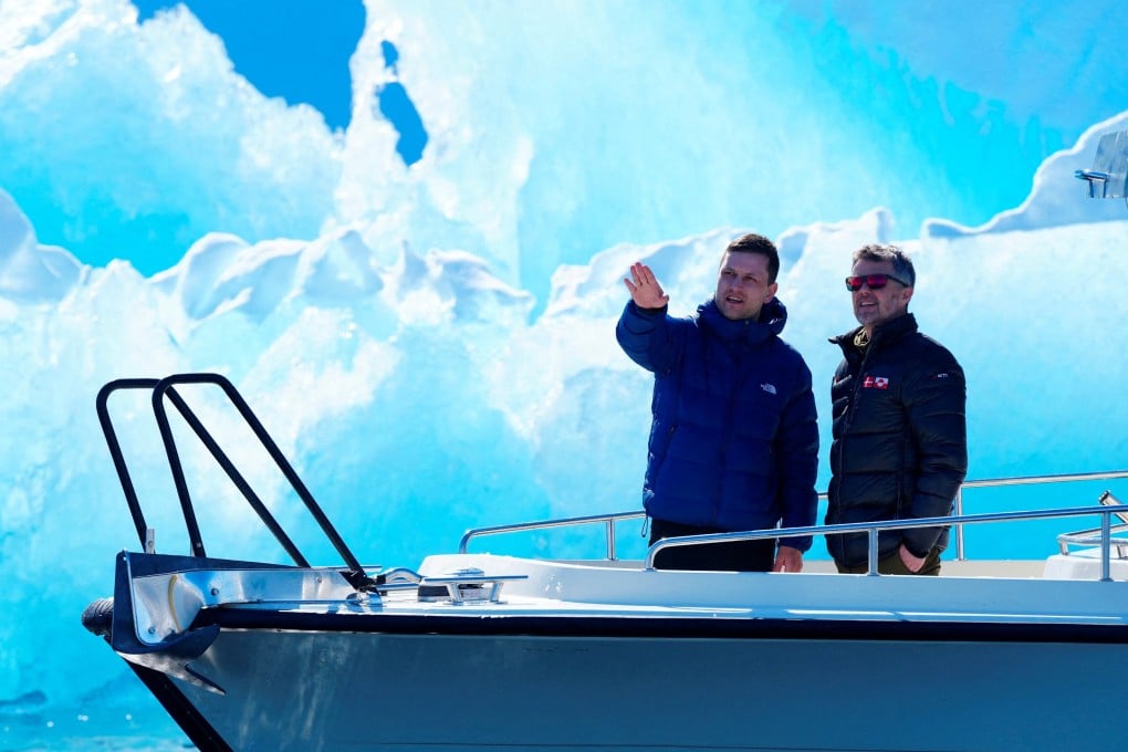 Denmark’s King Frederik (right) and Greenland’s head of government Jens-Frederik Nielsen are pictured in front of an iceberg during a boat trip in Nuuk fjord, in Greenland, on Tuesday. Photo: Ritzau Scanpix via Reuters