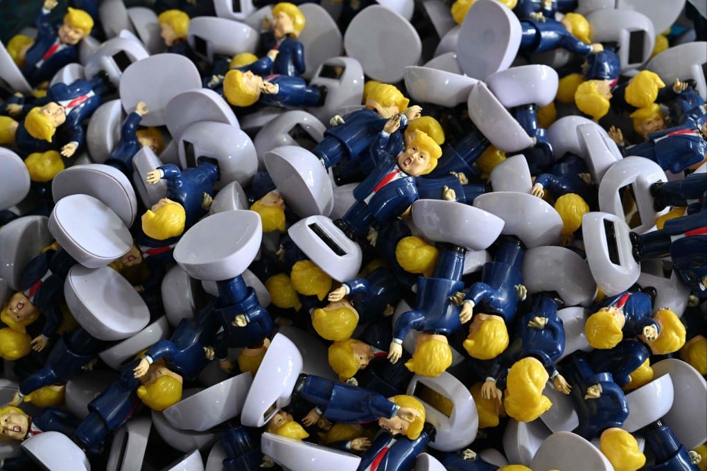 Parts for toys depicting US President Donald Trump are seen at a factory specialising in solar-powered plastic gadgets in Yiwu, in China’s Zhejiang province on April 11. Photo: AFP