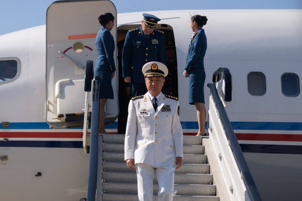 Miao Hua (centre), is the second member of China’s powerful Central Military Commission to be removed from his position since the current leadership took office in 2022. Photo: AFP