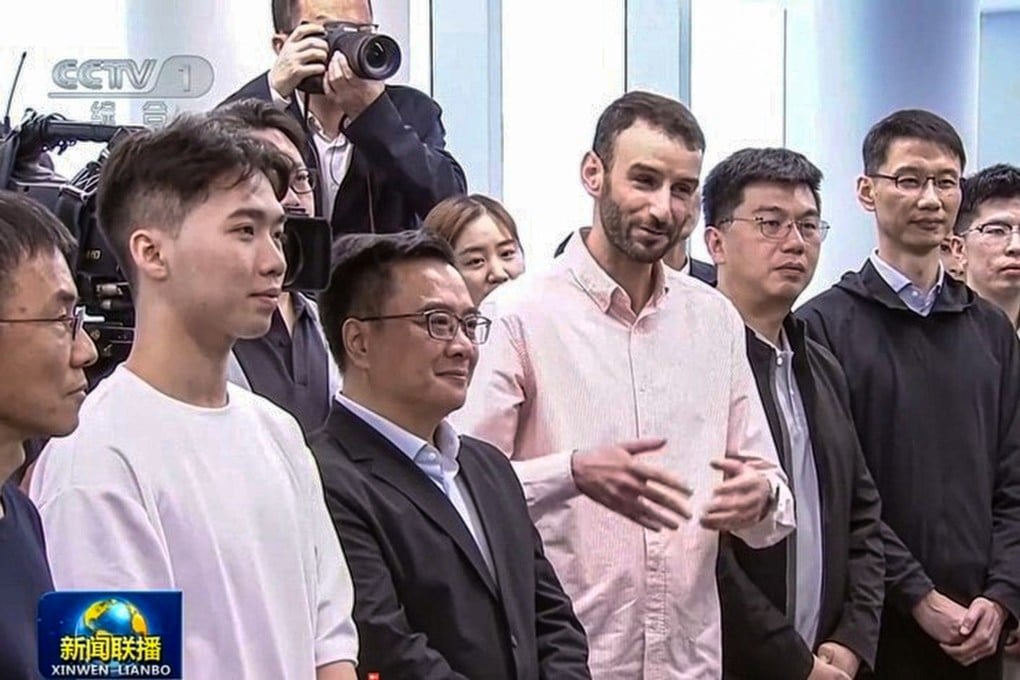 Hamza Boukili, a mathematics teacher at Shanghai Jiao Tong University, was part of the group on hand during an inspection tour by President Xi Jinping on Tuesday. Photo: CCTV