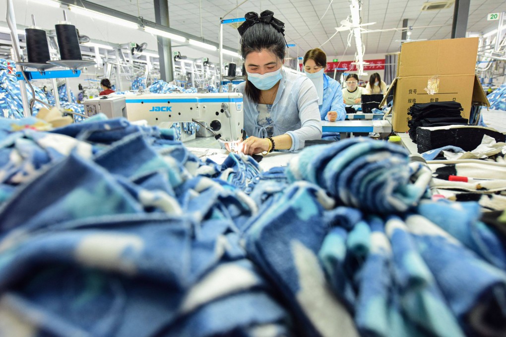 Workers produce pyjamas for export at a clothing factory in Lianyungang, in eastern China’s Jiangsu province, on April 21. Photo: AFP