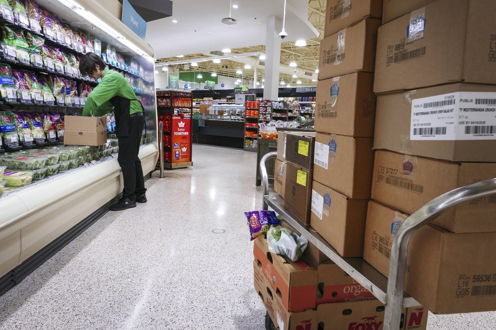 An employee organises grocery at a Publix supermarket in Miami. Photo: EPA-EFE