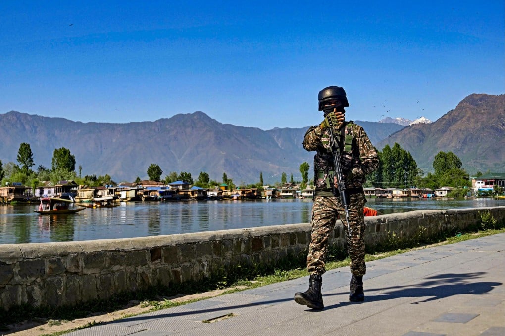 A paramilitary officer patrols along the banks of Dal Lake in Indian-administered Kashmir on Monday, days after an attack that killed 26 people and inflamed tensions between India and Pakistan. Photo: AFP