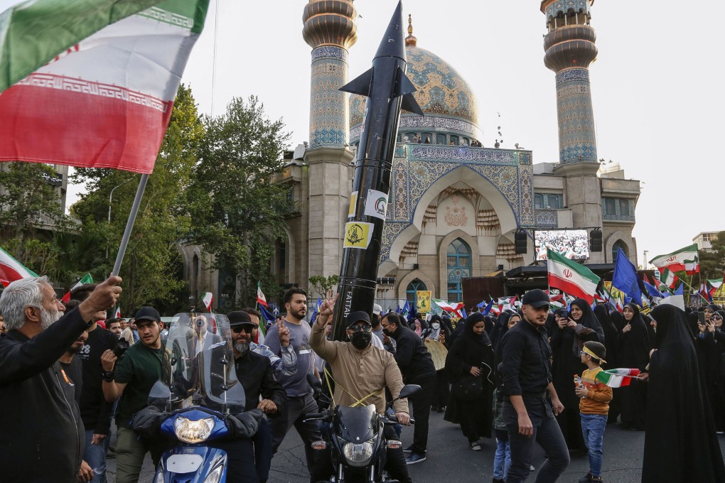 Iranians celebrate a missile and drone attack on Israel, on April 15, 2024, at Palestine square in central Tehran. Photo: TNS
