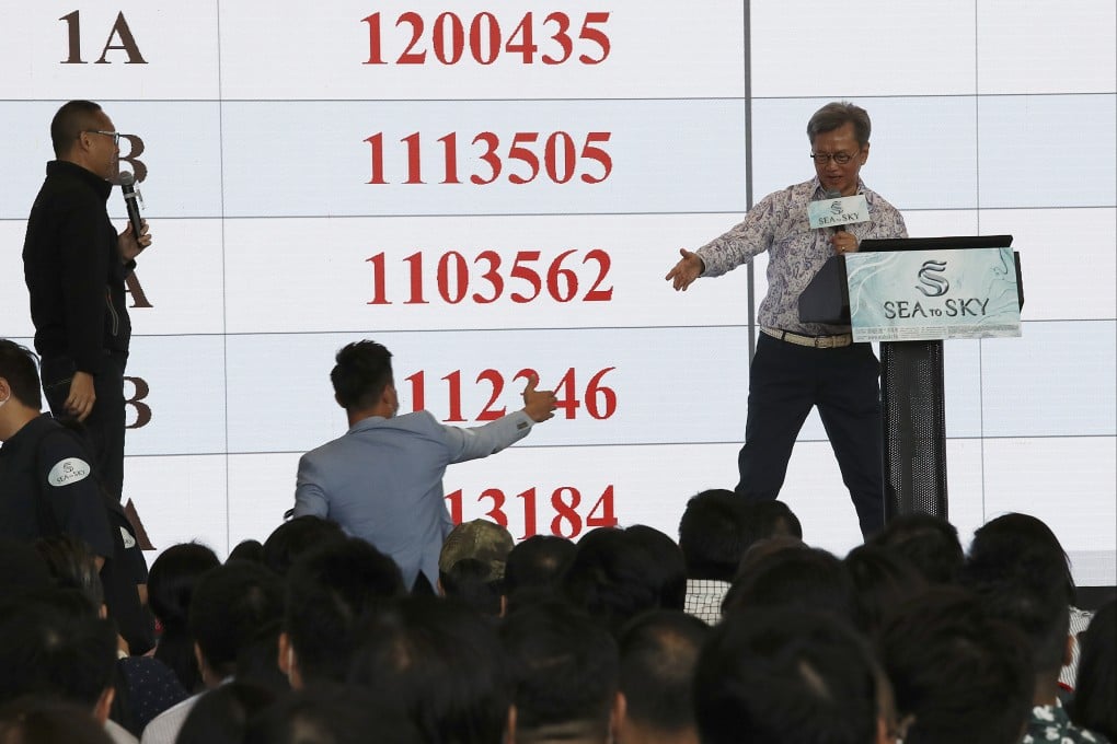 Executive director Justin Chiu Kwok-hung reaches out to a homebuyer during a project launch in 2020. Photo: Nora Tam